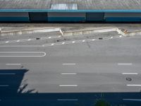 an empty lot with an empty parking lot in the background and clouds in the distance