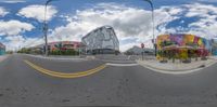 a fisheye image of a building and street view of an intersection in town center