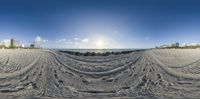 this is an image of the view from a 360 - shot of a beach with tracks