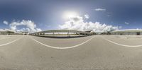 the view of an airport building, as seen through a fish eye lens as viewed in google image