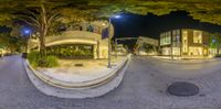 an image of a city street taken through a fisheye lens at night time in the usa