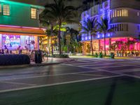 the ocean drive in south beach is lit up with purple and green lights as part of a new year's eve celebration