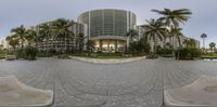 the fish eye lens captures a view of an apartment building from the outside of the photo