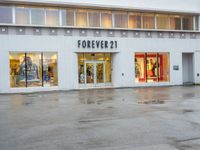 a photo of a store front with a fire hydrant on the street corner in front of it