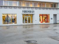 a photo of a store front with a fire hydrant on the street corner in front of it