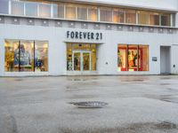 a photo of a store front with a fire hydrant on the street corner in front of it