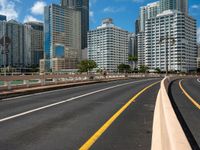 a street view of skyscrapers on a bright sunny day with a blue sky above