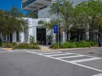 the man on his bike makes the right turns in front of an outdoor shopping center