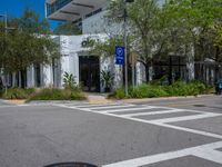 the man on his bike makes the right turns in front of an outdoor shopping center