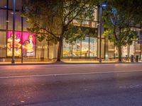 the city street is empty except for people to see at night time of this time of day