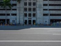 an empty lot with an empty parking lot in the background and clouds in the distance