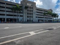 an empty lot with an empty parking lot in the background and clouds in the distance