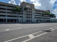 an empty lot with an empty parking lot in the background and clouds in the distance