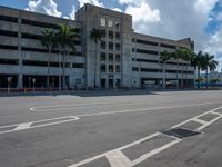 an empty lot with an empty parking lot in the background and clouds in the distance