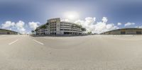 a panoramic view shows the empty parking lot in the city area with no cars