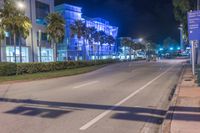 a long exposure photo of a road with traffic on the sidewalk at night in miami beach, florida