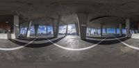 three spherical photos of a building, taken from a fish eye lens, with a city view in the background