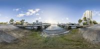 a fish eye view of boats docked in a dock next to the ocean and buildings