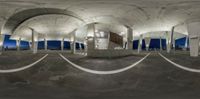 this is an 360 - view of the inside of a building at night with the roof partially down and a lot of windows