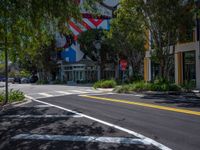 a street corner with the lines painted all over it's side and buildings and trees