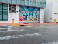 a colorful art mural on a building near the street corner in downtown honolulu, hawaii