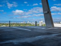 an aerial view of a city from a building rooftop top parking lot on a clear day
