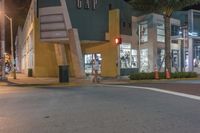 a man crosses a street in front of a clothing store with signs that say, tapa
