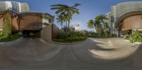 a 360 - view image of a parking lot and building as seen from a fish eye lens