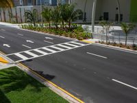 this road is running parallel between the two parking areas and in front of an office building