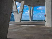 this is a view of some concrete buildings and water and a street sign, taken from the ground