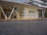 an outside shot of the entrance to a hotel in miami, florida, with lights on