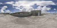 the 360 - view shows an industrial facility and its surroundings around it in the daytime