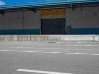 an empty lot with an empty parking lot in the background and clouds in the distance