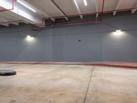 a skateboarder is riding in the middle of an empty room with a lot of lights