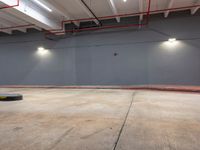 a skateboarder is riding in the middle of an empty room with a lot of lights