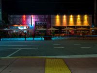 a view of a nightlife bar in downtown chicago at night with bright lights reflecting off the windows