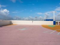 an empty parking lot near several tall buildings in the sky with a sky line on it