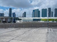 a sky view of a large city skyline and a parking space in a parking lot