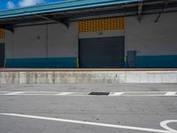 an empty lot with an empty parking lot in the background and clouds in the distance