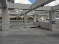 a car park is shown with a parking space in the middle of it and several buildings in the background