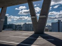 the empty roof is overlooking the city skyline on the sunny day with many clouds in the sky