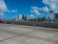 this is an image of a city overpass with traffic at low speed and speed