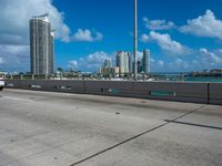 this is an image of a city overpass with traffic at low speed and speed