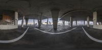 the circular view of a bridge through the bottom of a tunnel is amazing looking at it