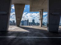 the view from the parking garage of cityscape and buildings on the horizon from the top of an elevated area