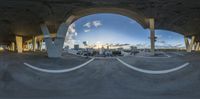 an image from the bottom of a fish eye view mirror, with the clouds in the distance