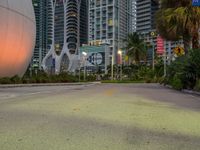 a photo taken from a road at dusk with a large sphere in the middle of it