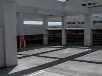 empty parking space with parking garages and parking ramps with steps that cross on them