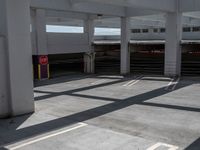 empty parking space with parking garages and parking ramps with steps that cross on them