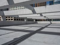 a skateboard is balanced against the building's steel beams in this photo from a low angle